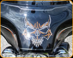 Master Pinstriper Casey Kennell striping on Harley Davidson