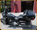 Master Pinstriper Casey Kennell striping on Harley Davidson