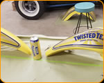 Casey Kennell painting and Lettering the 2019 Twisted Tea Bike. 