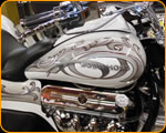 Master Pinstriper Casey Kennell striping on a Mountain Boss Hoss Trike