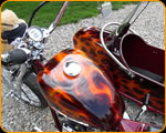 Casey Kennell painted these real flames on this nice Harley Davidson and Side Car