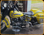 Casey Kennell painting and Lettering the 2019 Twisted Tea Bike. 