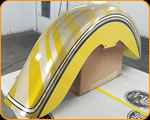 Casey Kennell painting and Lettering the 2019 Twisted Tea Bike. Cycle Source