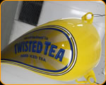 Casey Kennell painting and Lettering the 2019 Twisted Tea Bike. 