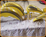 Casey Kennell painting and Lettering the 2019 Twisted Tea Bike. 