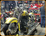 Casey Kennell painting and Lettering the 2019 Twisted Tea Bike. 