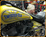 Casey Kennell painting and Lettering the 2019 Twisted Tea Bike. 